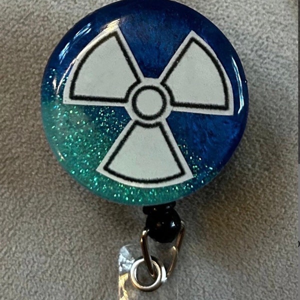 Choose your color Glow in the Dark Radiation symbol Retractable Badge Reel!