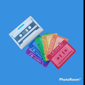 May include: A collection of colorful cassette tape-shaped items, including purple, blue, green, yellow, orange, and red. Each tape features a sound wave graphic and a Spotify logo. One tape has the text "A song never gets old".