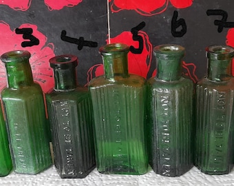Small hexagon and oblong poison bottles diffrent styles.