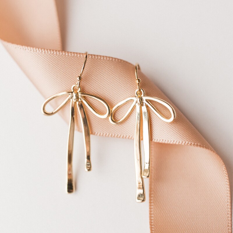 GOLD BEADED BOW EARRING main image 0