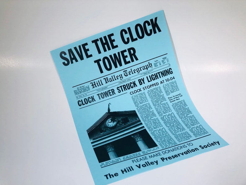 May include: A blue poster with the text "SAVE THE CLOCK TOWER" in black. The poster features a black and white image of a clock tower with the text "Hill Valley Telegraph" and "CLOCK TOWER STRUCK BY LIGHTNING" in black. The text "CLOCK STOPPED AT 10:04" is also in black. The poster also includes the text "PLEASE MAKE DONATIONS TO The Hill Valley Preservation Society" in black.