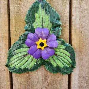 Morning Glory leaves cast in cement hand painted with flower in center