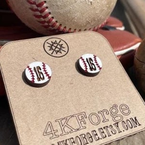 May include: A pair of wooden baseball earrings with the number 16 on them. The earrings are on a brown card with the text "4KForge" and "4KForge.etsy.com".