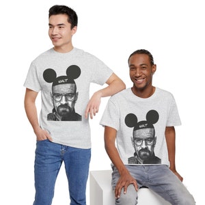 May include: Two men wearing grey t-shirts with a black and white image of Walter White from Breaking Bad wearing Mickey Mouse ears. The text "@WALT" is on the headband of the ears.