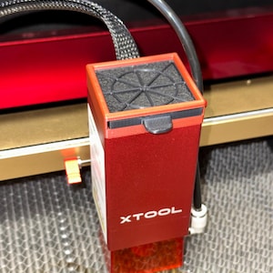 May include: A red laser engraving machine with a black filter and a red XTOOL logo.