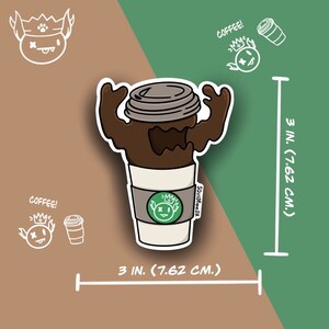 May include: A sticker featuring a coffee cup with a monster design. The coffee is brown, and the cup is white with a green logo. The sticker is 3 inches (7.62 cm) in size. The word "COFFEE!" is written on the sticker.