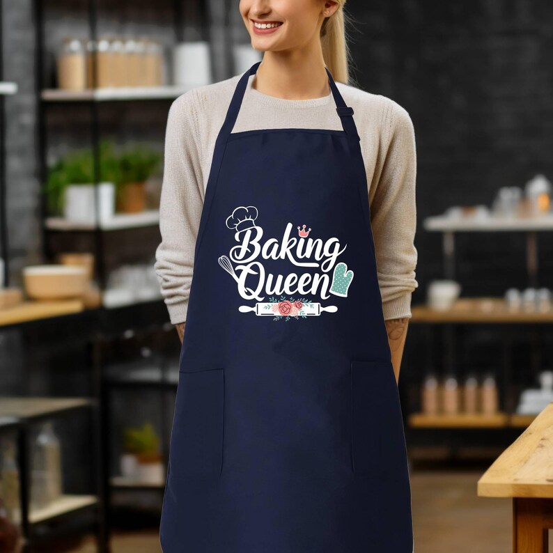 a woman wearing an apron that says baking queen