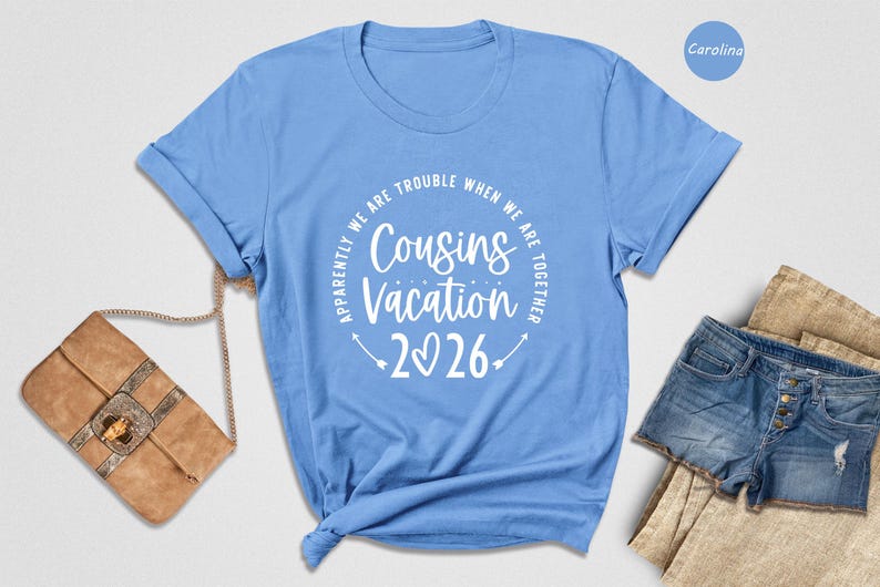 A blue t-shirt with a white text design that reads "Approximately we are trouble when we are together" and "Cousins vacation 2026" is displayed on a white background.