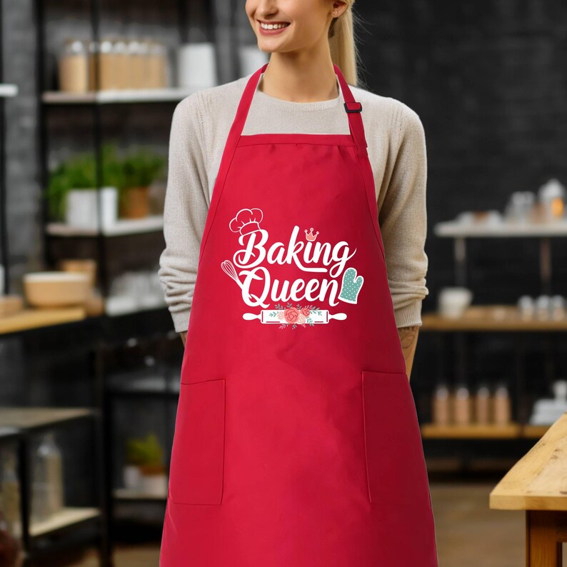 a woman wearing a red apron with the words baking queen on it