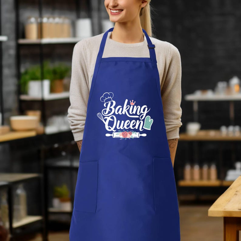 a woman wearing an apron with the words baking queen on it