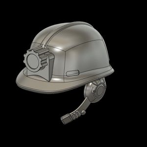 May include: A metallic gray hard hat featuring a front-mounted circular lamp housing with a gear-like edge and a side-mounted communication device with a boom microphone extending downward, rendered in a smooth, three-dimensional digital style.