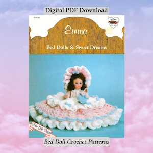 May include: Crochet pattern for a bed doll named Emma. The pattern includes instructions for making a doll and a bed. The doll is wearing a white dress with pink and blue accents. The bed is white with pink and blue trim. The pattern is available as a digital PDF download.