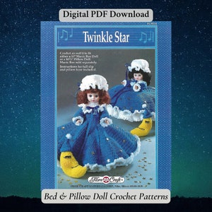May include: A crochet pattern for a bed and pillow doll. The pattern is called "Twinkle Star" and features two dolls dressed in blue gowns with white trim and yellow crescent moon pillows. The pattern is for a 13-inch Music Box Doll or a 10-inch Pillow Doll.