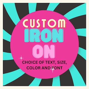 May include: A graphic design with the words "CUSTOM IRON ON" in a pink circle, with the text "CHOICE OF TEXT, SIZE, COLOR AND FONT" below. The background has a black and teal radial design.
