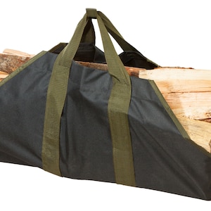 May include: A black firewood carrier bag with olive green handles and trim, filled with split logs. The bag is made of a durable material and designed for easy transport of firewood. The bag is designed to hold a large amount of firewood.