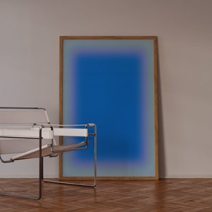May include: A white leather chair with a chrome frame sits in front of a framed blue and purple gradient artwork on a wooden floor.