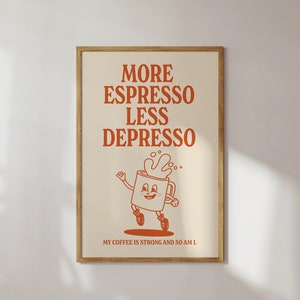 May include: A framed poster with the words "MORE ESPRESSO LESS DEPRESSO" in orange lettering. Below the text is a cartoon coffee cup character with a smiling face and running legs. The phrase "MY COFFEE IS STRONG AND SO AM I" is at the bottom.