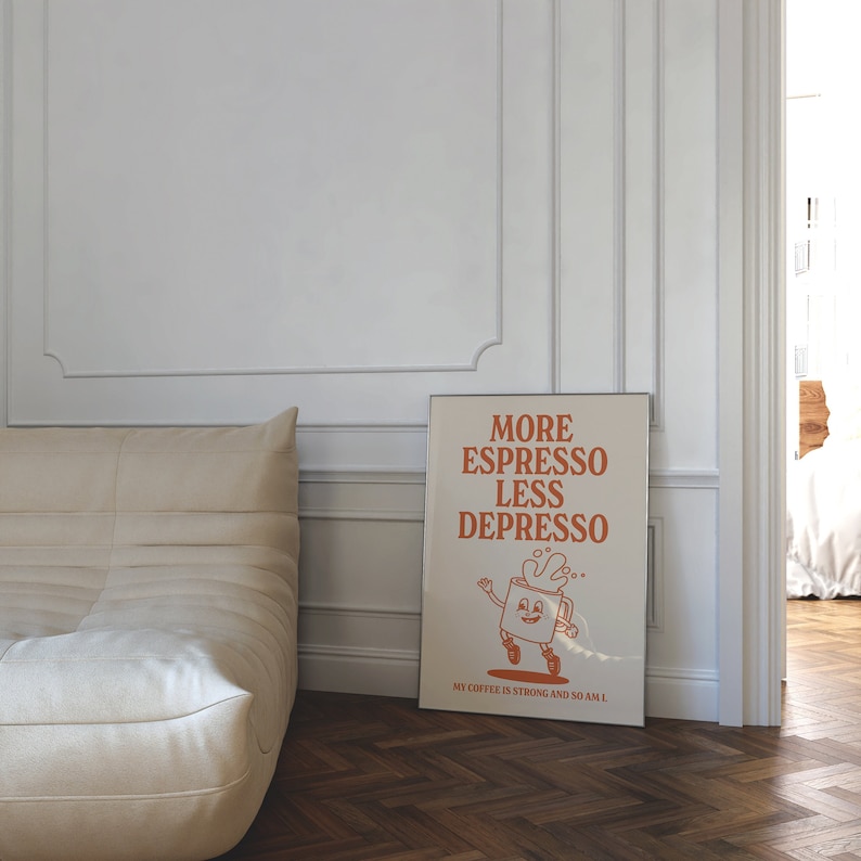 May include: A framed poster with the text "MORE ESPRESSO LESS DEPRESSO" in orange. The poster features a cartoon coffee cup character and the phrase "MY COFFEE IS STRONG AND SO AM I."