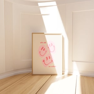 May include: A framed print with a white background and three pink smiley faces. The text "oh ok" and "so what" is printed in pink.
