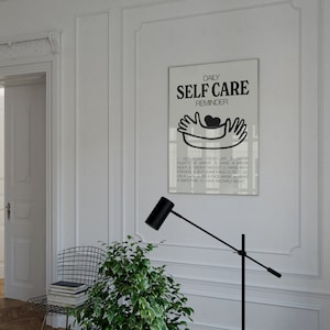 May include: A black and white poster with the text "DAILY SELF CARE REMINDER" and a simple illustration of two hands holding a heart. The poster lists 10 self-care tips.
