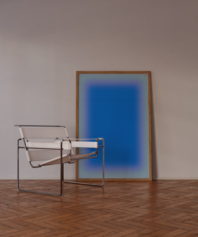 May include: A white leather chair with a chrome frame sits in front of a framed blue and purple gradient artwork on a wooden floor.