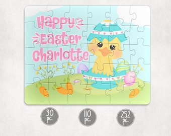 May include: A personalized Easter puzzle featuring a yellow chick hatching from a blue egg with pink hearts. The puzzle says "Happy Easter Charlotte" in pink letters.
