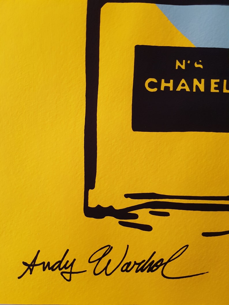 May include: A yellow background with a black outline of a perfume bottle. The bottle has a black label with the text "N'5 CHANEL" on it. The image is signed "Andy Warhol" in black ink.