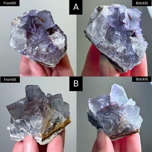 May include: Two clusters of purple and clear fluorite crystals labeled A and B, shown in frontlit and backlit views. The mineral specimens feature cubic crystal formations with deep violet hues, translucent sections, and visible matrix rock bases.