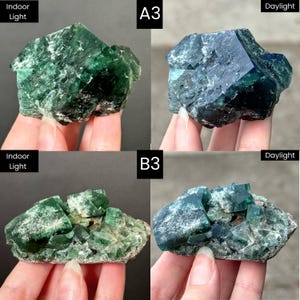 May include: A collection of green fluorite crystal specimens labeled A3 and B3, shown under indoor light and daylight. The crystals feature geometric, cubic structures with translucent and opaque green facets, displaying variations in color depth.