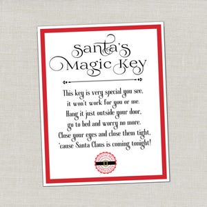 May include: A rectangular white card with a red border featuring the black text Santa's Magic Key and a poem about hanging a key outside a door. At the bottom is a circular red and white official seal of Santa Claus with a black belt graphic.