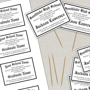 May include: Printed certificates with black borders and text. Some certificates read "Your School Name" and "Graduate Name." Others say "Southlake High School" and "Jackson Lawrence." The certificates are on a light-colored surface.