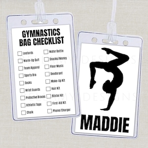 May include: Two clear plastic badge holders with white inserts. One lists a gymnastics bag checklist, including items like leotards and water bottles. The other features a black gymnast silhouette and the name "MADDIE".