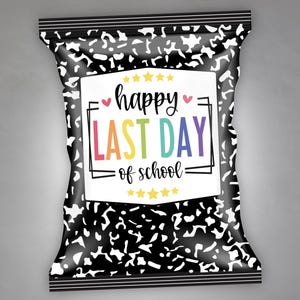 May include: A black and white patterned snack bag with the text "happy LAST DAY of school" in colorful letters. The bag has a white rectangular label with the text and is decorated with yellow stars and pink hearts.
