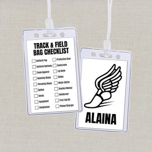 May include: Two clear plastic track and field bag tags with white text and graphics. One tag has a checklist, the other has a winged foot graphic and the name "ALAINA". Both tags are attached to white lanyards.
