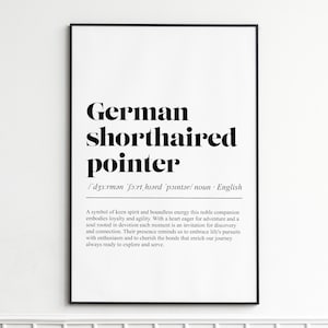 May include: A framed print with the words "German shorthaired pointer" in bold black lettering. Underneath is the phonetic pronunciation and the word "noun". The print also contains a description of the dog's qualities.