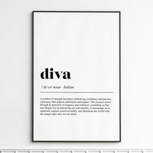 May include: A framed print with the word "diva" in bold black font. Below, the definition reads "/ˈdiːvə/ noun Italian." The definition text describes strength, grace, and individuality. The frame is black, and the background is white.