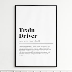 Peut inclure: Impression encadrée avec le texte "Train Driver" en gras, noir. La prononciation phonétique et le mot "nom" sont également présents. Fond blanc, cadre noir.