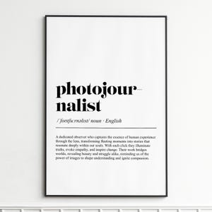 May include: A framed print with the word "photojournalist" in a bold, black font. Below, the definition is provided, along with a description of the profession. The print is in a black frame.