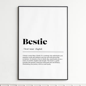 Peut inclure: Une affiche encadrée en noir avec le mot "Bestie" en gras noir. En dessous, la définition de "Bestie" en anglais. L'affiche est affichée sur un fond blanc.