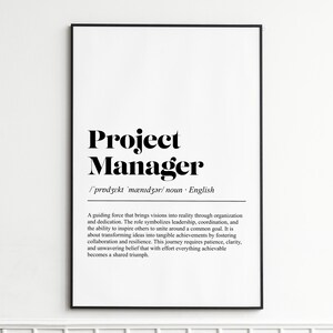May include: Black framed print with the words "Project Manager" in a bold, serif font. Below the title is the phonetic pronunciation and the word "noun". The print includes a definition of the role.