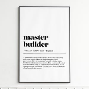Puede incluir: Impresión enmarcada con las palabras "master builder" en negrita negra. Debajo, la pronunciación fonética y la palabra "sustantivo". Fondo blanco, marco negro. Ideal para decoración del hogar.