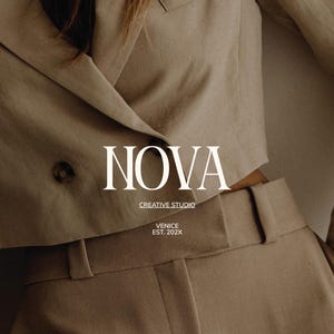 May include: A beige suit jacket with a two-button closure and matching high-waisted trousers. The text "NOVA CREATIVE STUDIO VENICE EST. 202X" is displayed in white. The outfit is made of a textured fabric.