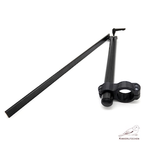 May include: Black motorcycle handlebar with a clamp and a long, straight arm. The handlebar has a curved section and a small lever. The image is on a white background. The brand name "KINKERLITZCHEN" is in the bottom right corner.