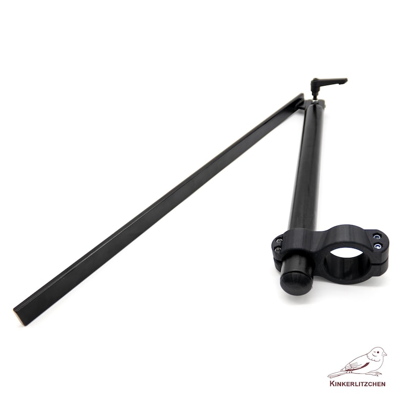 May include: Black motorcycle handlebar with a clamp and a long, straight arm. The handlebar has a curved section and a small lever. The image is on a white background. The brand name "KINKERLITZCHEN" is in the bottom right corner.