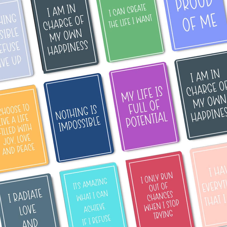 May include: A set of 10 colorful affirmation cards with positive messages. The cards feature white text on a variety of colored backgrounds, including blue, green, pink, and yellow. The messages include "I am in charge of my own happiness", "Nothing is impossible", "My life is full of potential", and "I only run out of chances when I stop trying".