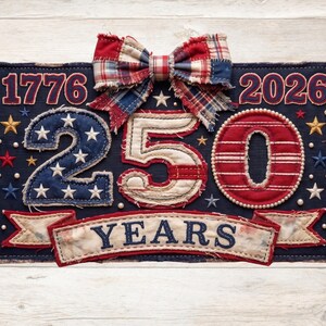 May include: A patriotic decorative piece with the numbers "1776" and "2026" flanking "250 YEARS". The design features a navy blue background with red, white, and blue accents, stars, and a plaid bow. The numbers are in a patchwork style.