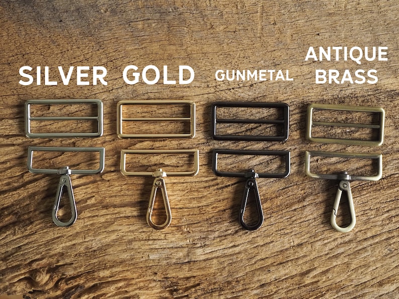 May include: Four metal slider buckles with matching swivel hooks in silver, gold, gunmetal, and antique brass.