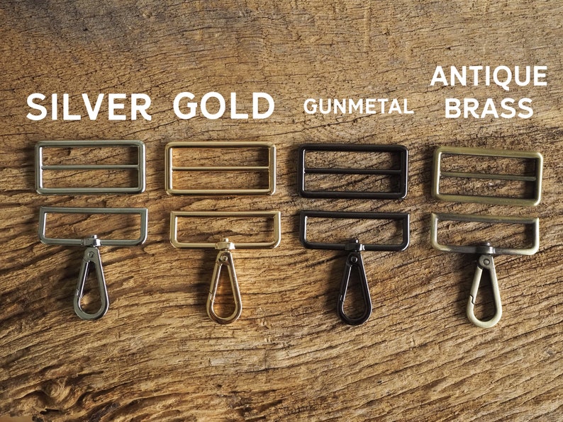May include: Four metal slider buckles with matching swivel hooks in silver, gold, gunmetal, and antique brass.
