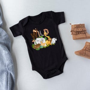 May include: Black baby onesie with a graphic print of jungle animals spelling out the word "WILD".
