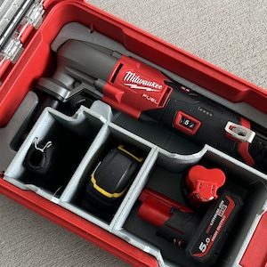 May include: A red Milwaukee FUEL oscillating tool with a black battery and a gray and black carrying case.